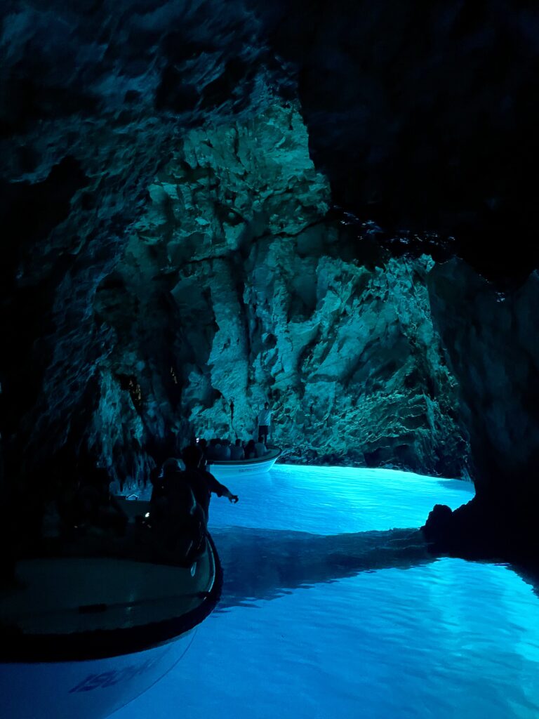 The interior of the Blue Cave on Biševo island near Vis, showing the natural electric blue light reflecting off the water.