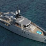 Aerial view of an ultra-modern luxury yacht sailing through the crystal-clear turquoise waters of the Adriatic Sea, showcasing sleek minimalist design and solar-integrated decking.